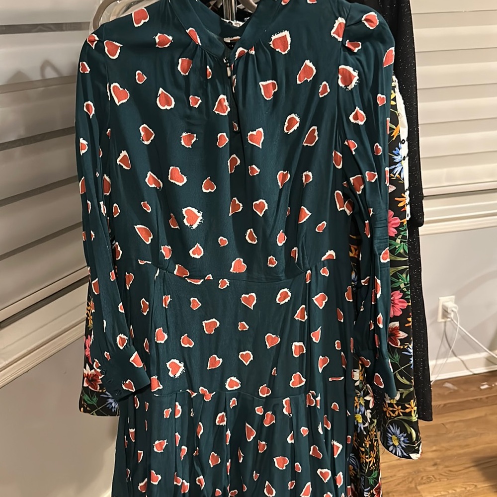 Green flirty dress with red hearts, fit and flare. Side zip.